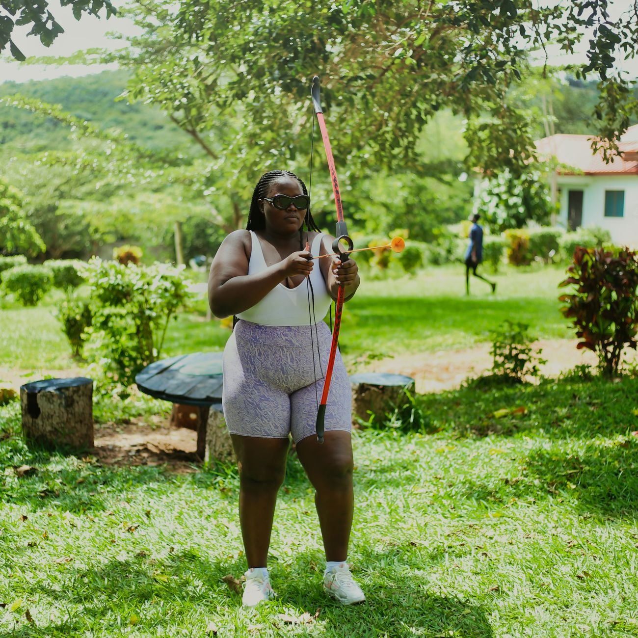 Archery practice outdoors — wrist strap bow release for hunting